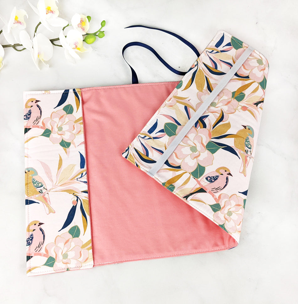 fabric book cover with birds and magnolia flowers.