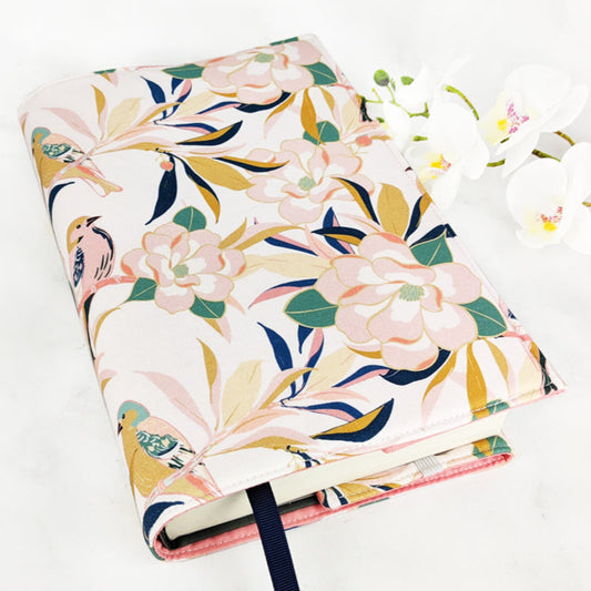 fabric book cover with birds and magnolia flowers.