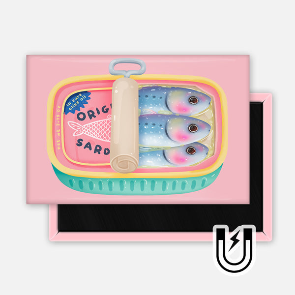 Pink rectangular magnet featuring an illustrated sardine tin with two pastel-colored fish and a retro-style label reading “Original Sardines.”