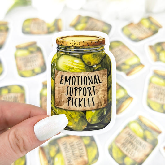 Vinyl sticker of a pickle jar labeled “Emotional Support Pickles,” held by a hand with iridescent white nail polish.